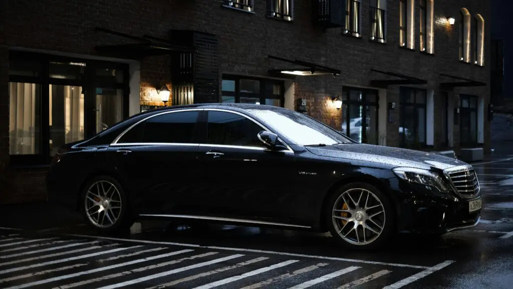 A black car parked on the side of a street.